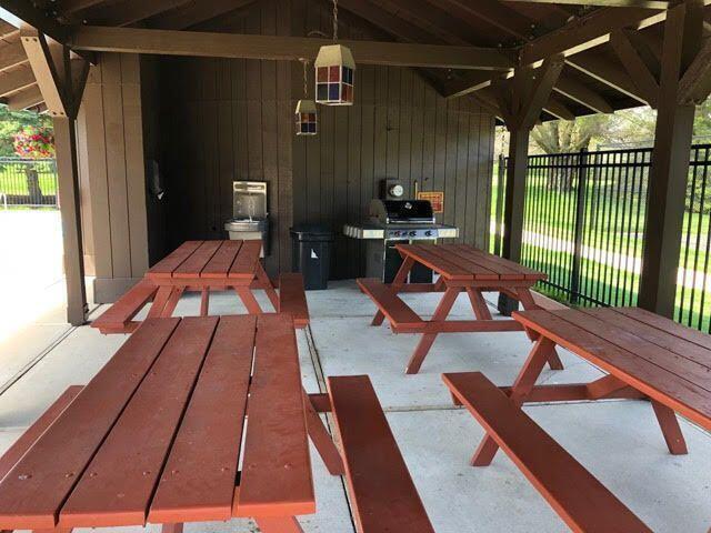 view of patio with a grill and fence