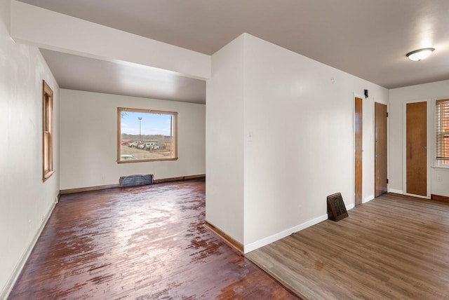 interior space featuring wood finished floors and baseboards