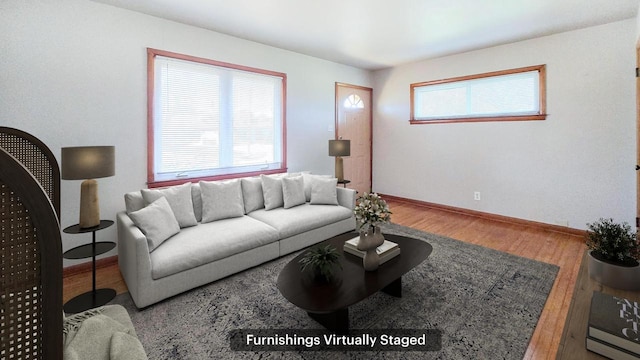 living room featuring baseboards and wood finished floors