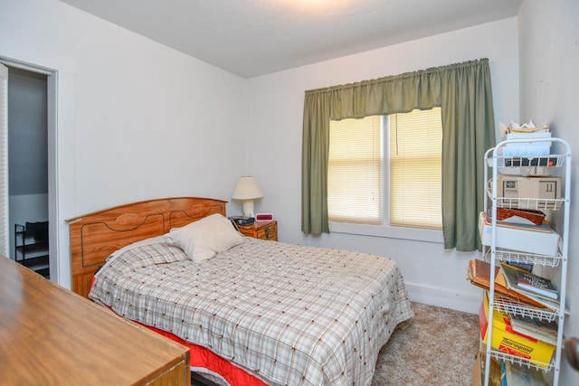 carpeted bedroom with baseboards