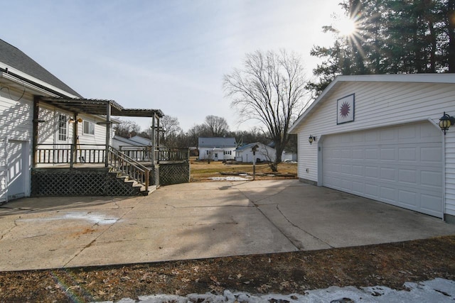 exterior space featuring a wooden deck and an outbuilding