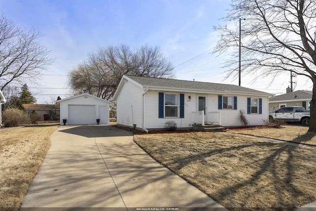 single story home featuring a garage, driveway, and an outdoor structure