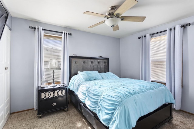 bedroom featuring a ceiling fan, baseboards, and light carpet