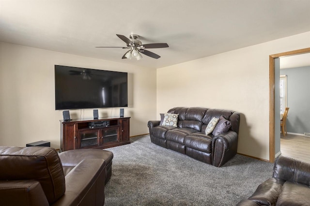 living room with baseboards, carpet floors, and ceiling fan