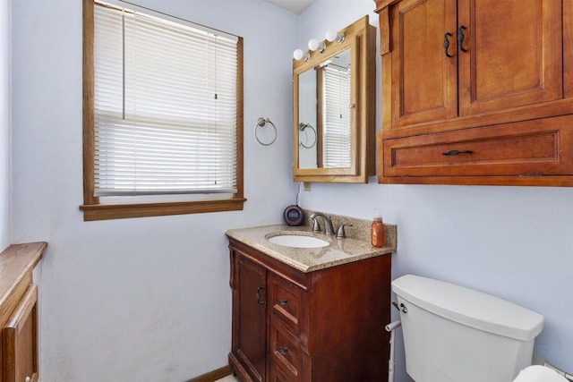 bathroom with toilet and vanity