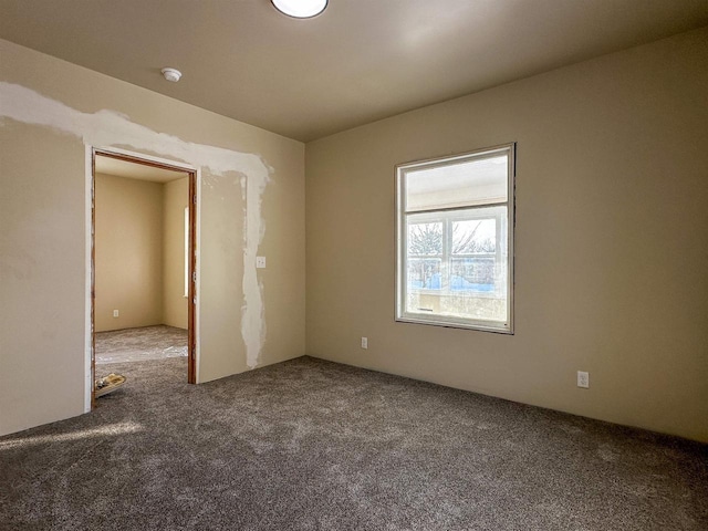 unfurnished room featuring carpet flooring