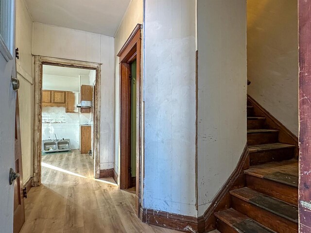 corridor with stairway and wood finished floors