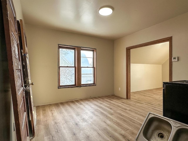 interior space featuring light wood-type flooring and a sink