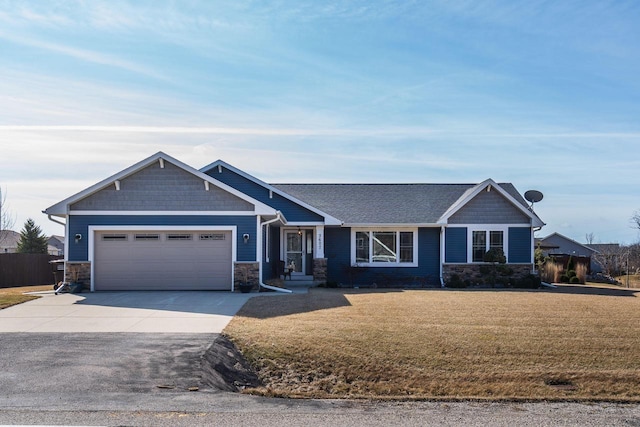 craftsman house featuring a front lawn, a garage, stone siding, and driveway