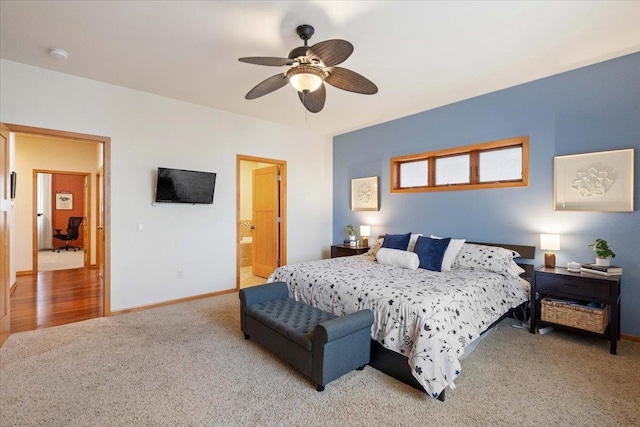 bedroom featuring carpet flooring, ceiling fan, ensuite bath, and baseboards