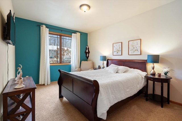 carpeted bedroom with baseboards