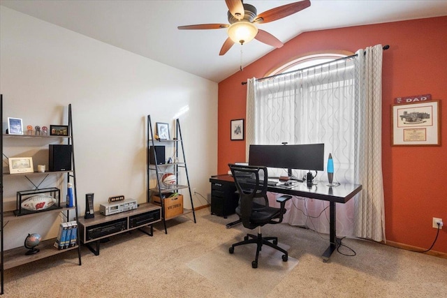 office space featuring a ceiling fan, lofted ceiling, and carpet floors