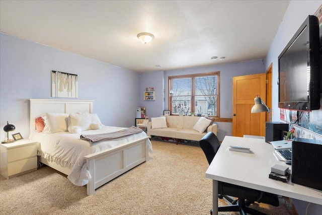 bedroom featuring light carpet