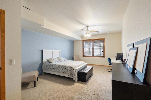 carpeted bedroom with baseboards and ceiling fan