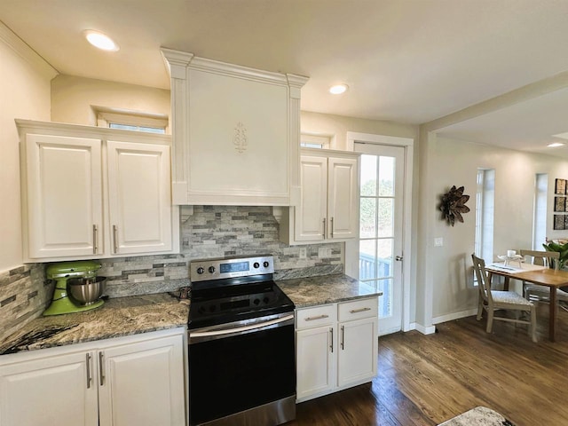 kitchen featuring backsplash, white cabinets, and stainless steel range with electric cooktop