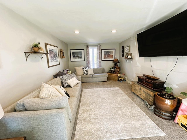 living room with light carpet and recessed lighting