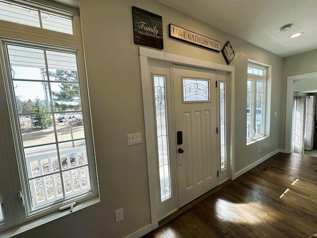 entrance foyer with recessed lighting, baseboards, and dark wood-type flooring