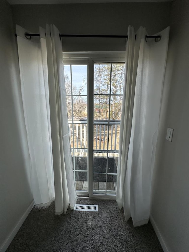 interior space with baseboards and visible vents