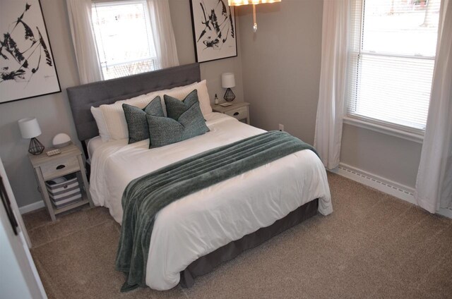 bedroom featuring baseboards, carpet floors, and baseboard heating