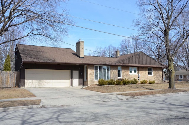 ranch-style home with a shingled roof, fence, concrete driveway, a chimney, and an attached garage