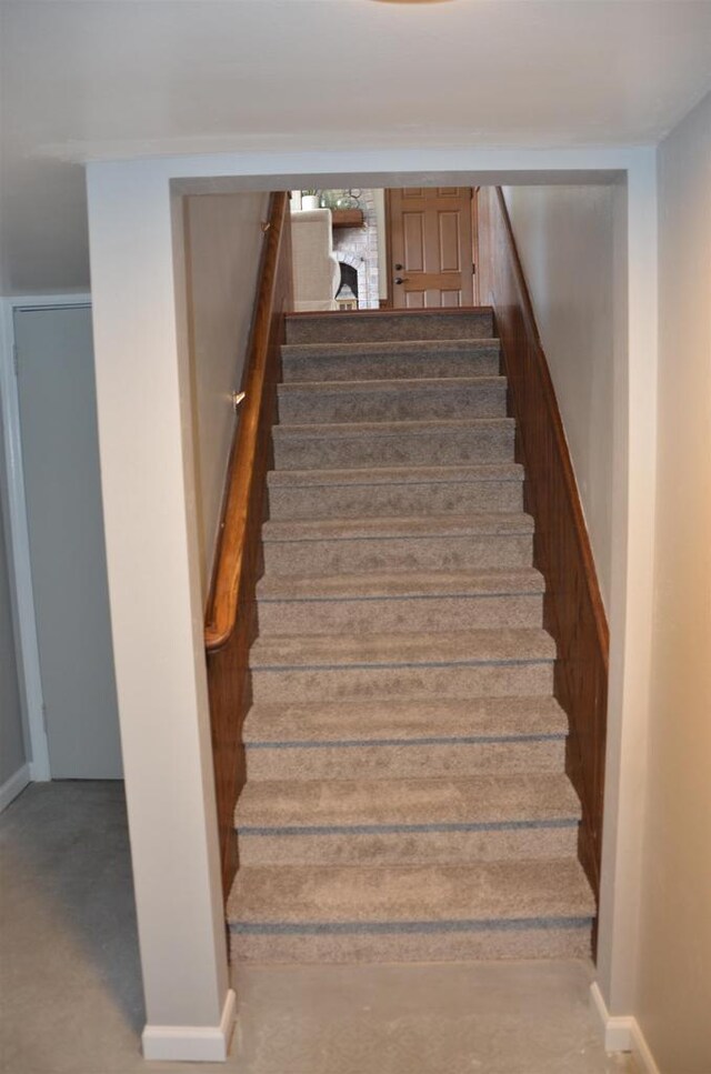 stairway featuring baseboards