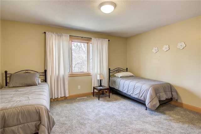 bedroom with visible vents, baseboards, and carpet floors