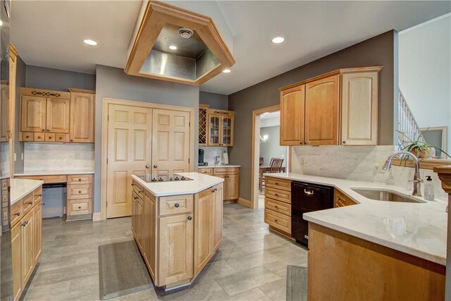 kitchen featuring a sink, backsplash, black appliances, and recessed lighting