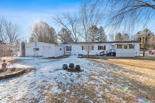 view of snow covered house