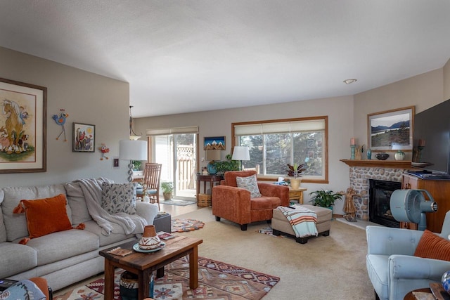 living room featuring carpet flooring and a glass covered fireplace