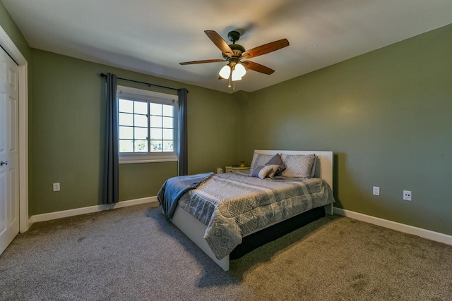 carpeted bedroom featuring baseboards and ceiling fan