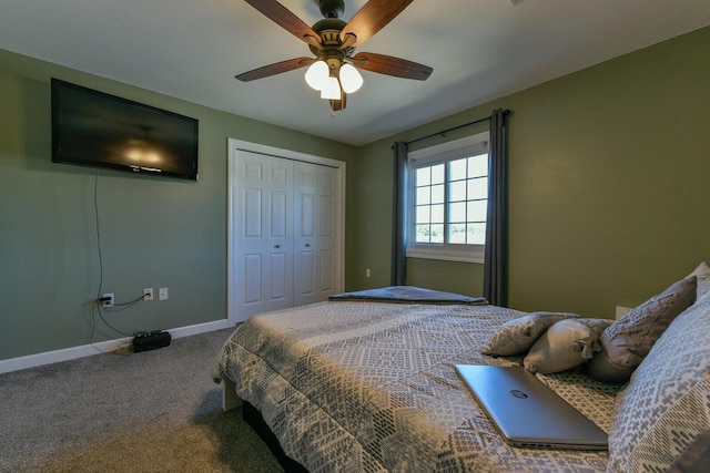 carpeted bedroom featuring baseboards, a closet, and ceiling fan