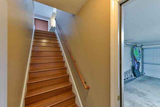 stairway with unfinished concrete floors