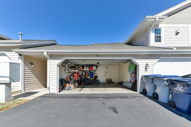 garage featuring driveway