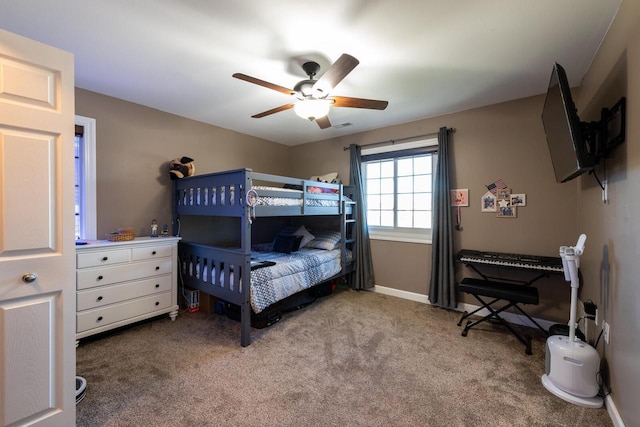 bedroom featuring baseboards, a ceiling fan, and carpet flooring