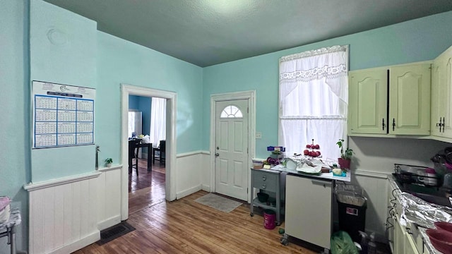 entryway with wood finished floors and visible vents