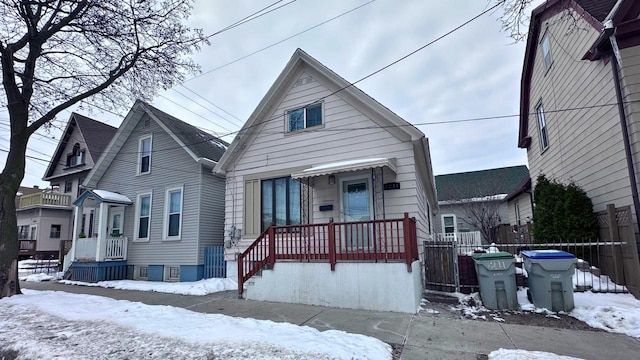 view of front of house featuring fence