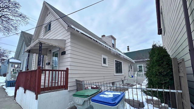 view of property exterior with fence