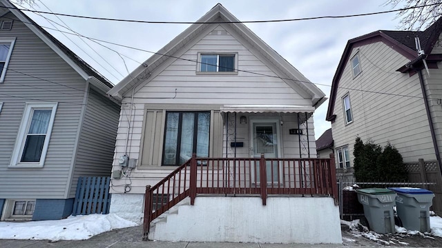 view of front of house featuring fence