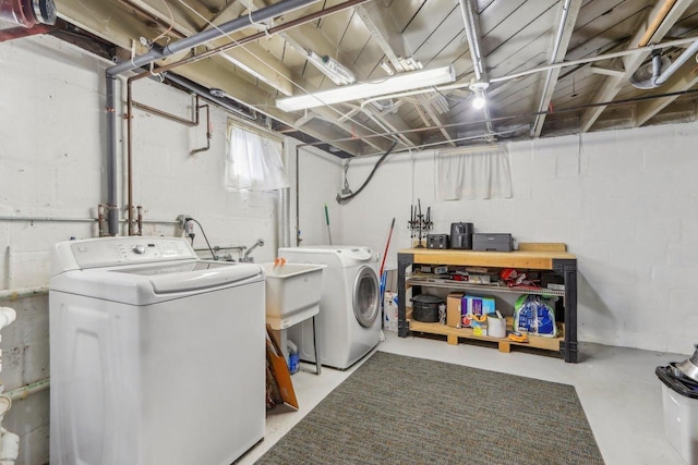 washroom featuring laundry area and washing machine and clothes dryer