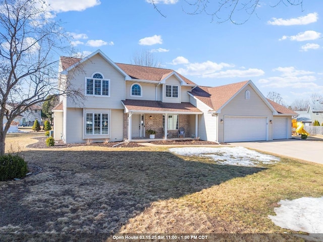 traditional-style home featuring a front yard, covered porch, concrete driveway, a garage, and brick siding