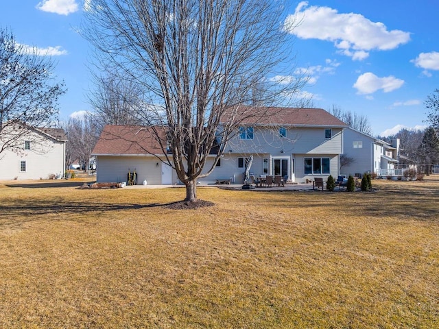 back of property featuring a patio and a yard