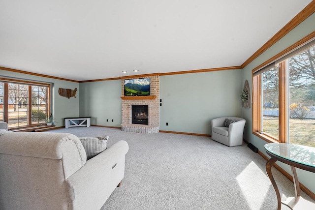 living area featuring carpet flooring, a fireplace, baseboards, and ornamental molding