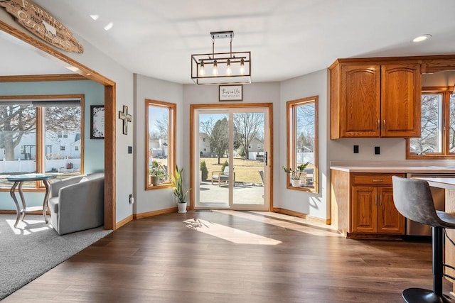 interior space featuring dark wood finished floors, recessed lighting, and baseboards