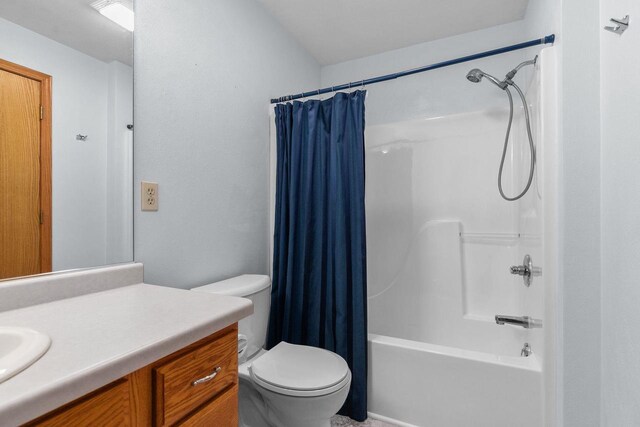 bathroom featuring vanity, toilet, and shower / bath combo