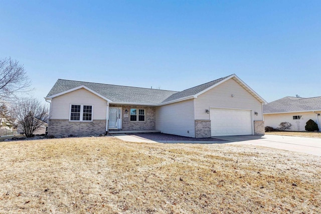 single story home featuring brick siding, a front lawn, concrete driveway, roof with shingles, and an attached garage