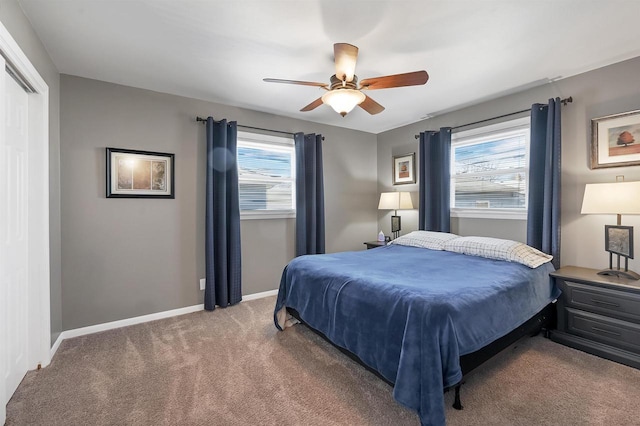 carpeted bedroom featuring a ceiling fan and baseboards