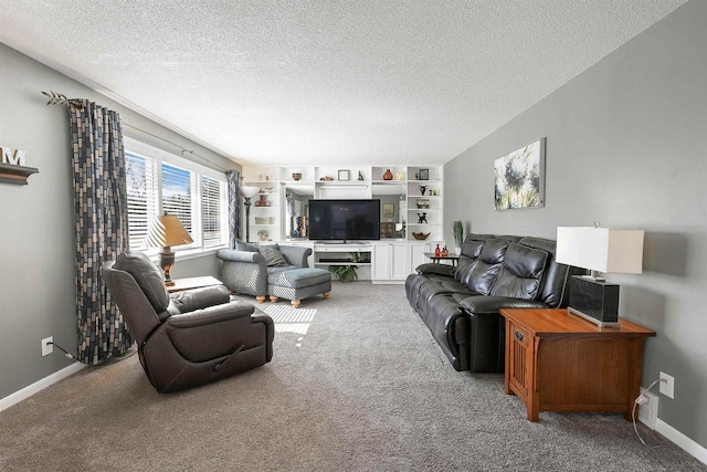 carpeted living room with baseboards and a textured ceiling