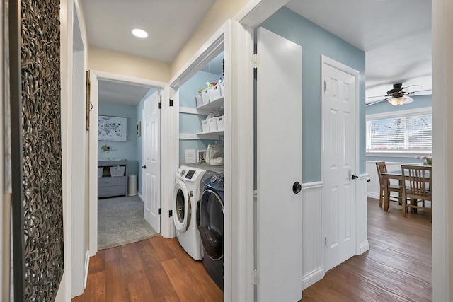 washroom featuring washing machine and clothes dryer, dark wood-style floors, laundry area, and ceiling fan