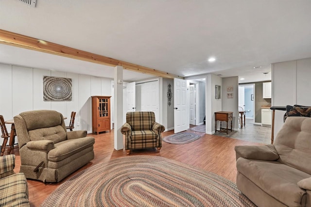 living room with recessed lighting and light wood-style floors