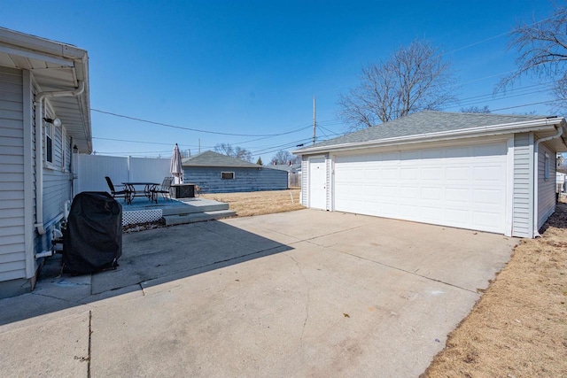 detached garage with fence